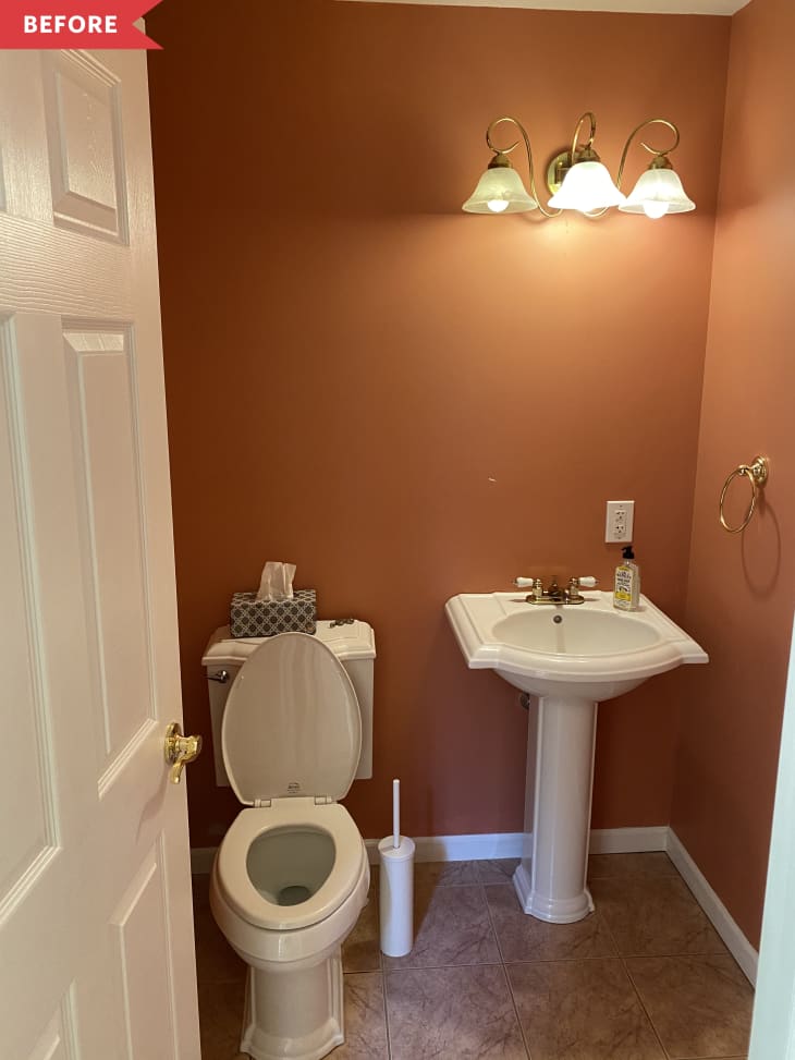 Before: Half bathroom with dark orange walls, white pedestal sink, and beige floors