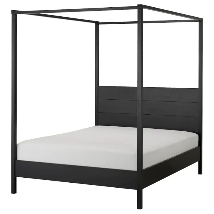IKEA YTTERVAG four-poster bed in black, with white mattress