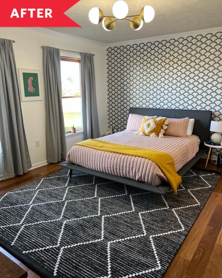 After: Bedroom with zigzag rug and scalloped accent wall behind bed