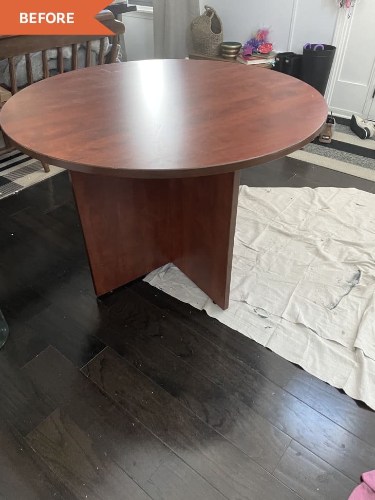 Before: Round laminate table with a shiny red-toned wood finish
