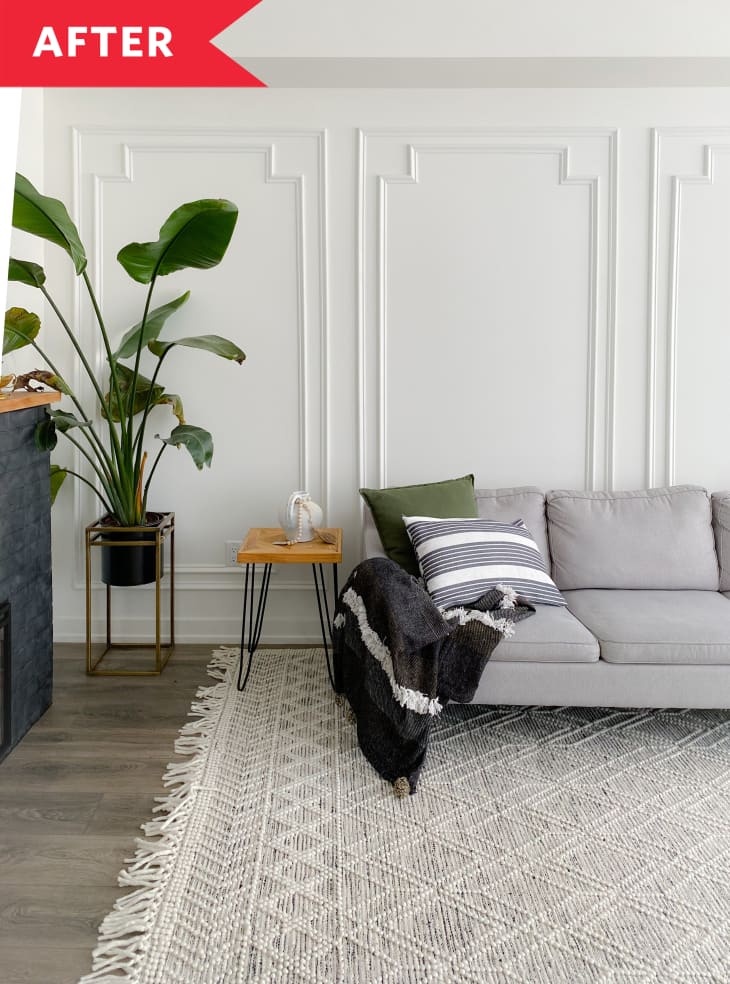 white wall with picture frame molding white rug