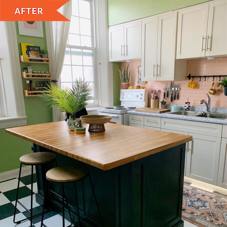Green kitchen with island and checkered floor