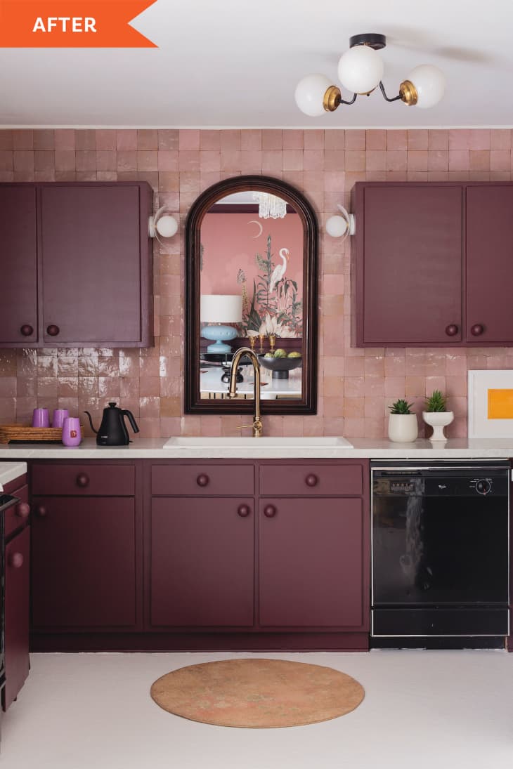 Merlot kitchen cabinets and a mirror over the sink