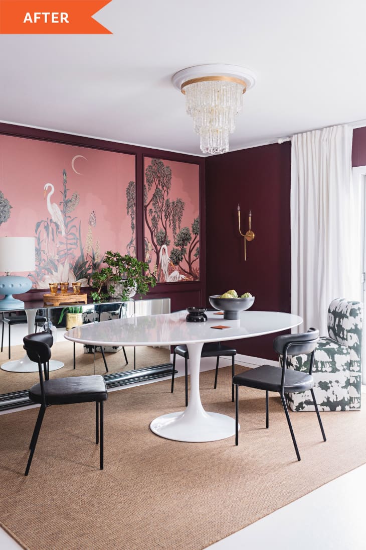 Painted dining room with crane and trees on the wall and a white dining table