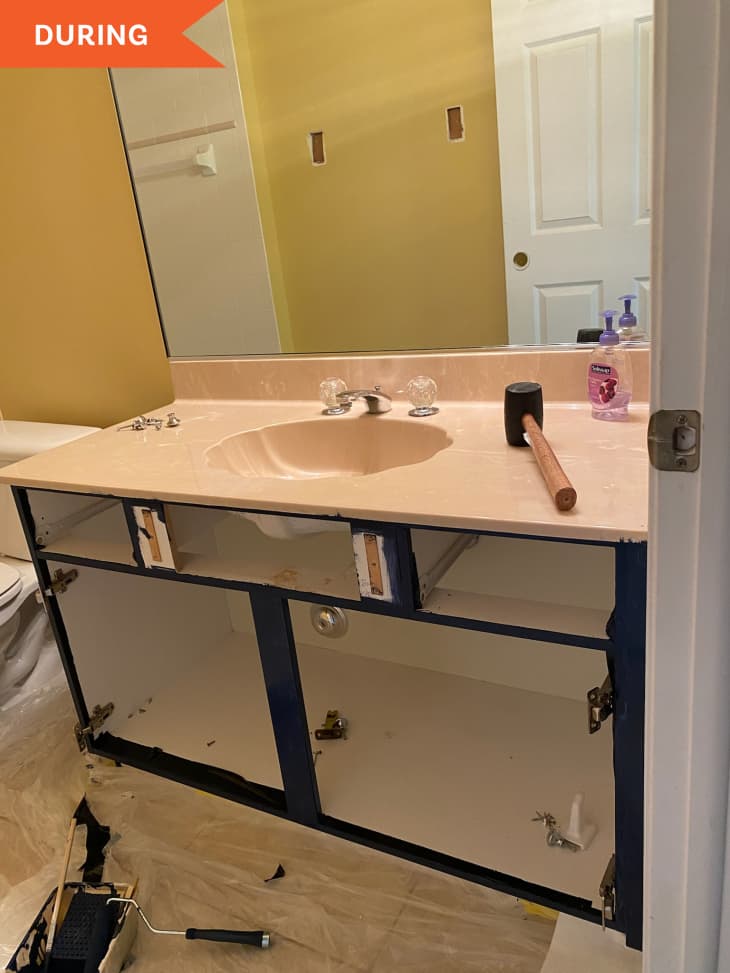 During: Cabinet doors removed from vanity