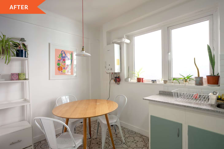 After: Round wooden table in corner of bright white kitchen