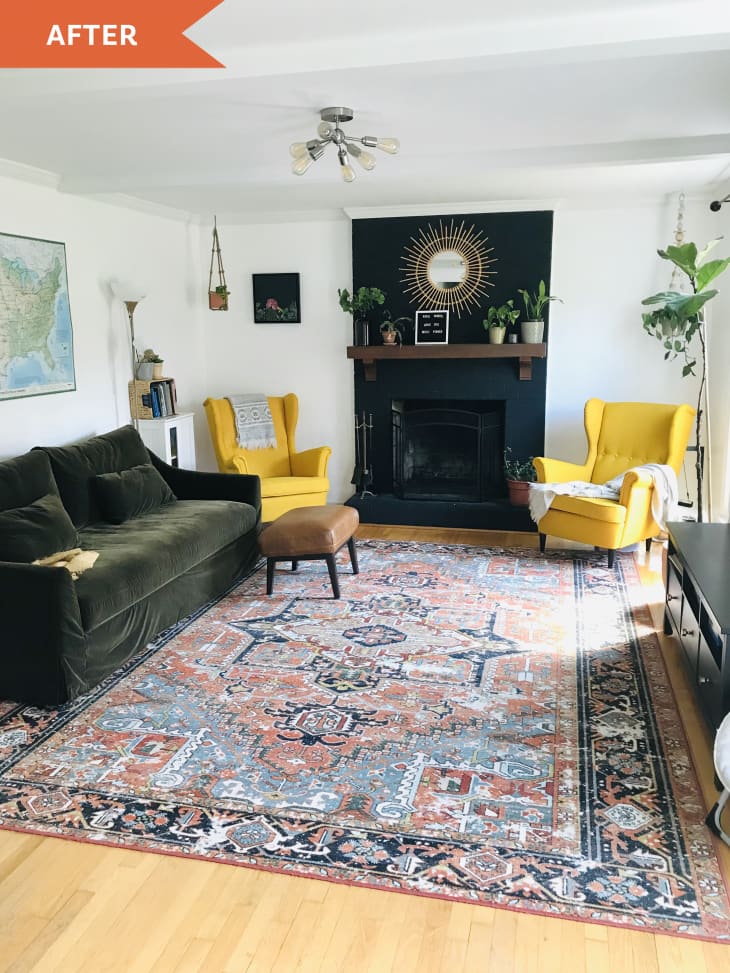 After: living room with large red patterned rug, green velvet sofa, and two yellow chairs next to a fireplace