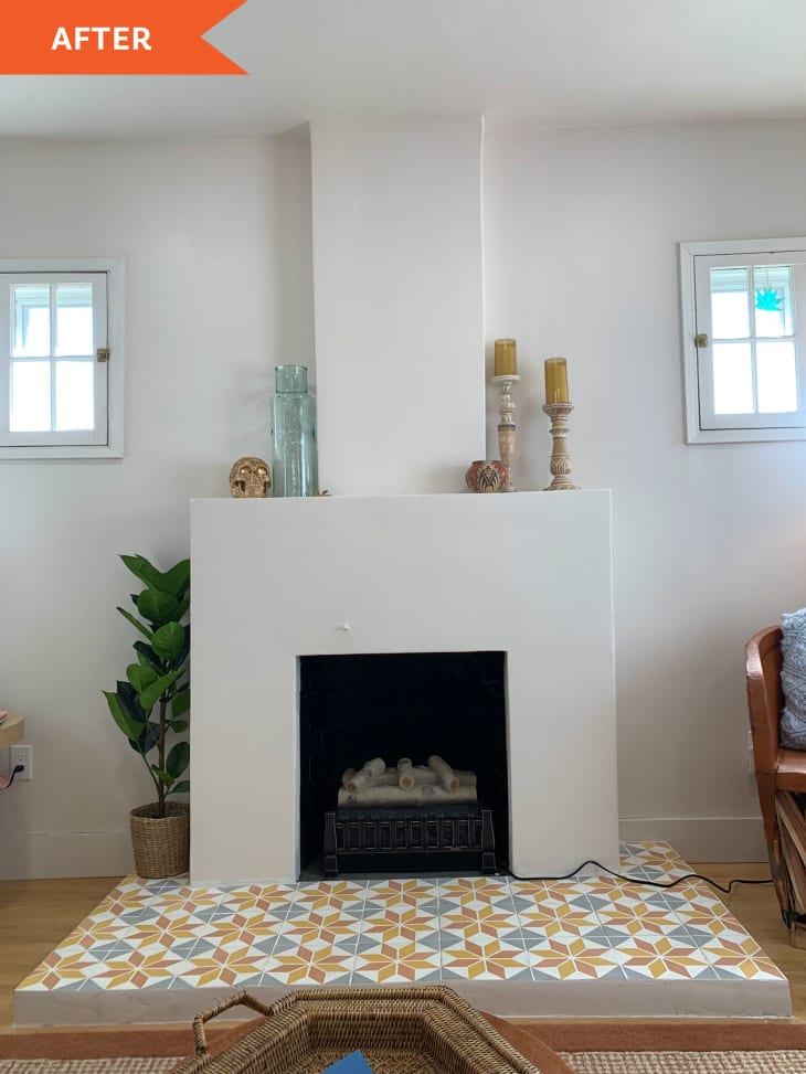 After: white painted fireplace and the patterned tile floor in front of it