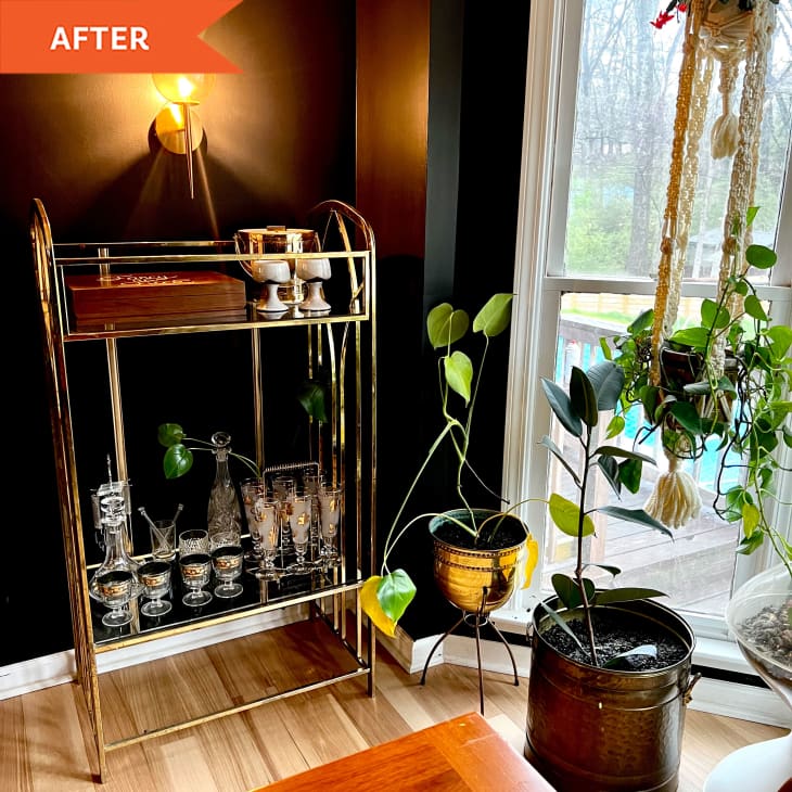 After: gold bar cart next to plants and window