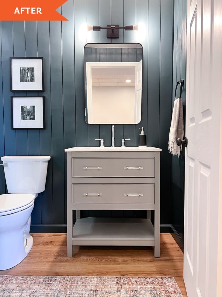 After: white painted bathroom with gray cabinet
