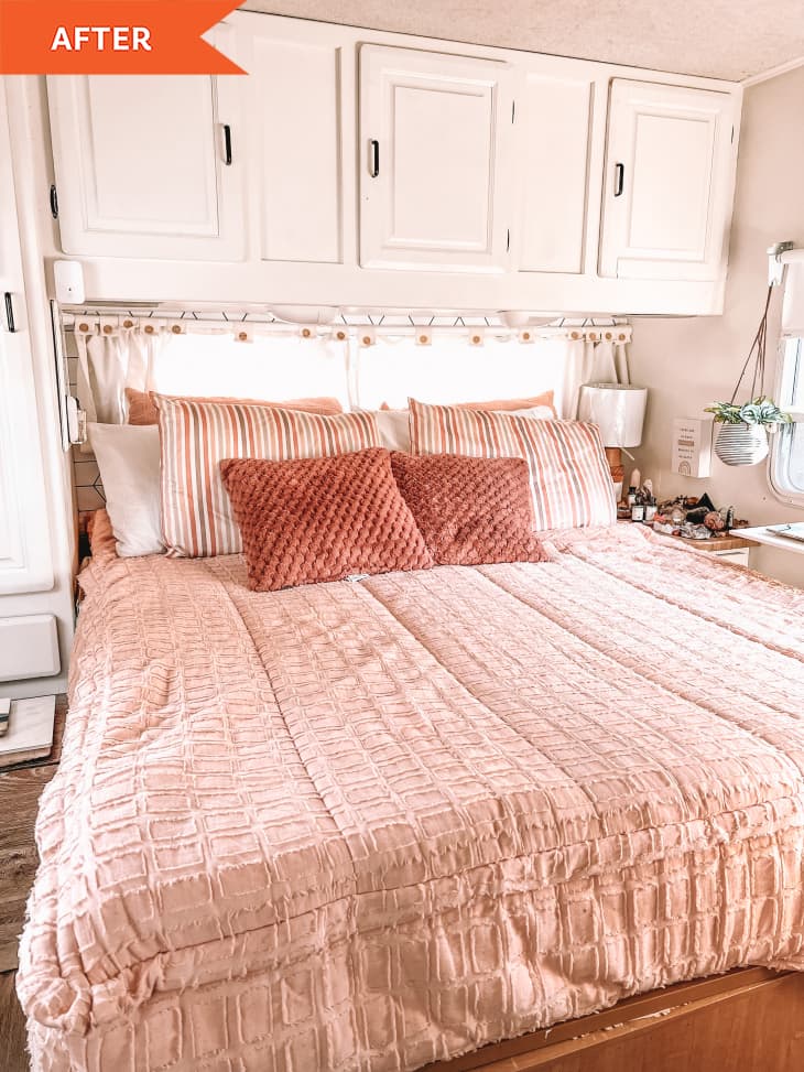 After: pink bed below white cabinets