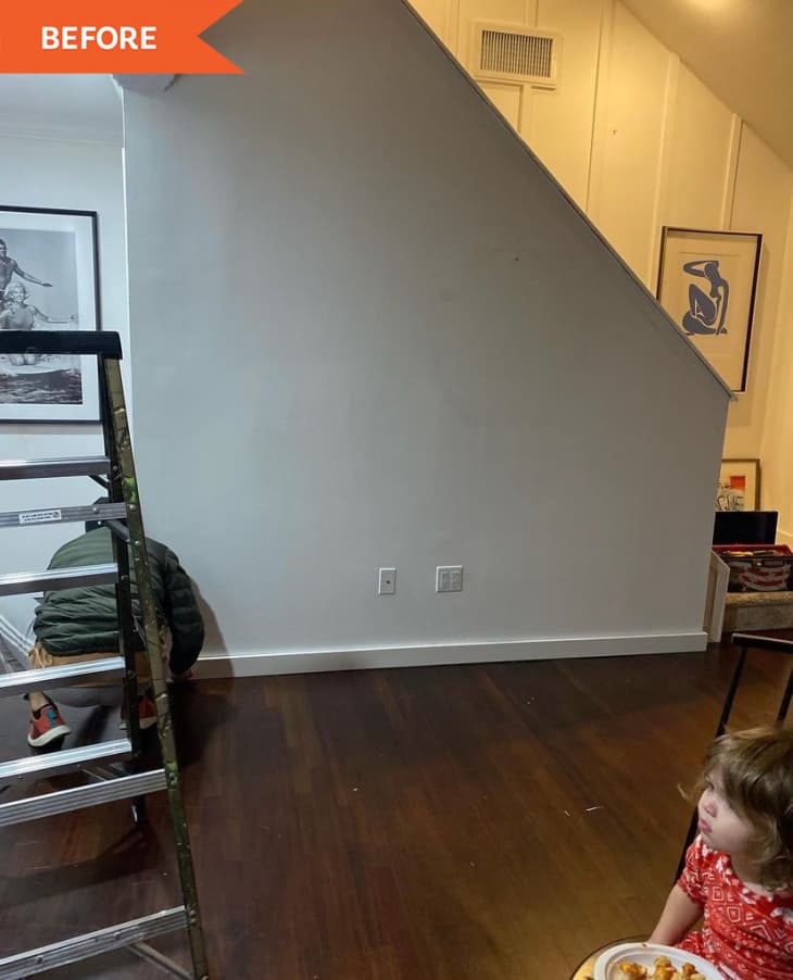 Before: white plain wall on side of stairs