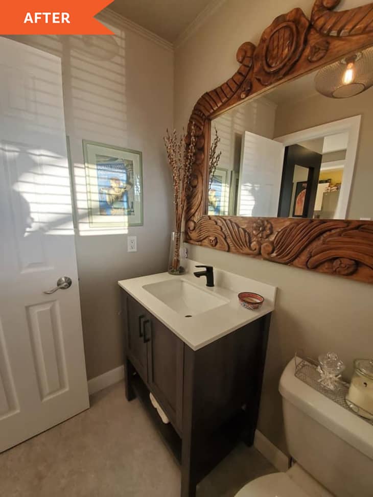 After: bathroom with mirror, sink, and toilet