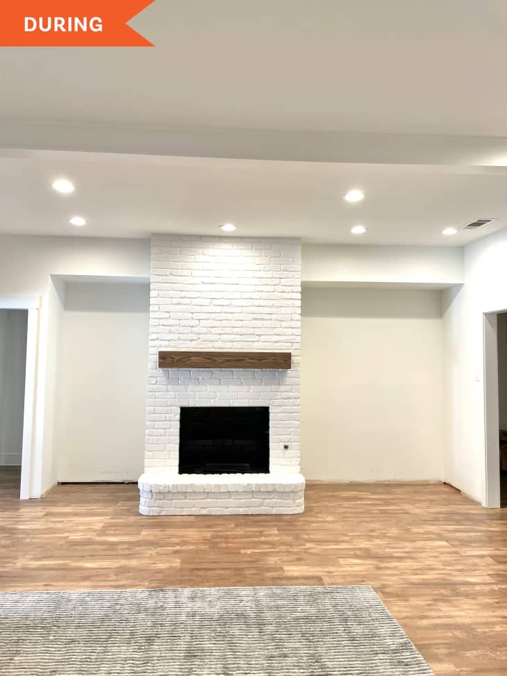 During: White brick fireplace with no shelving next to it