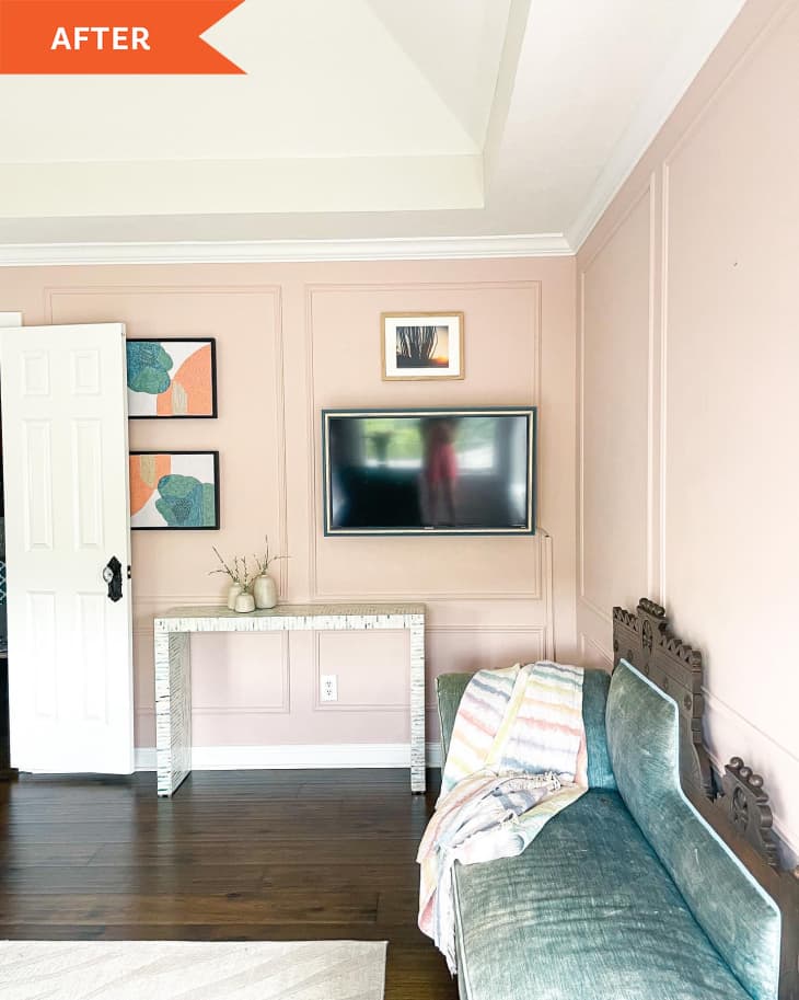 After: Pink walls with a tv and blue couch