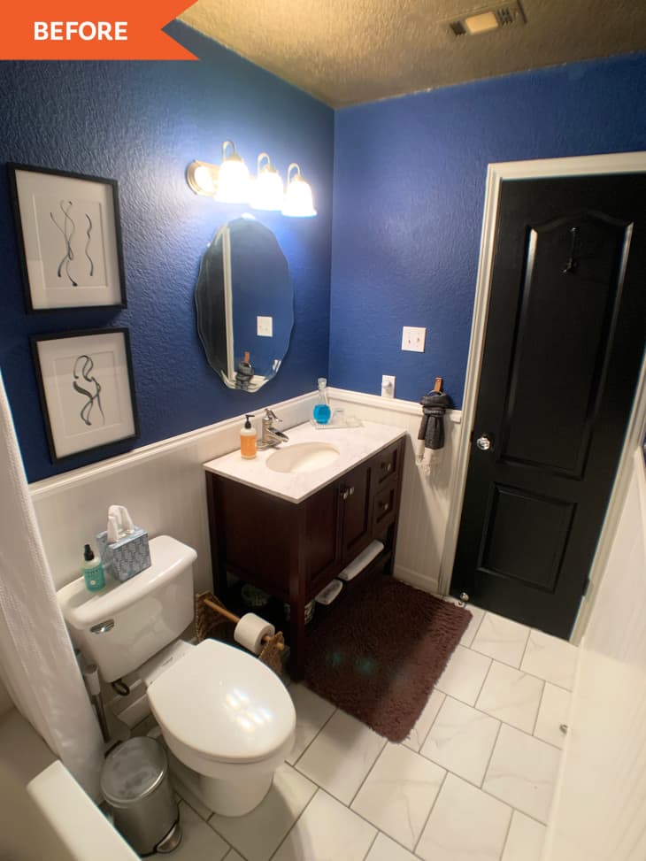 Before: Blue and white bathroom with black door