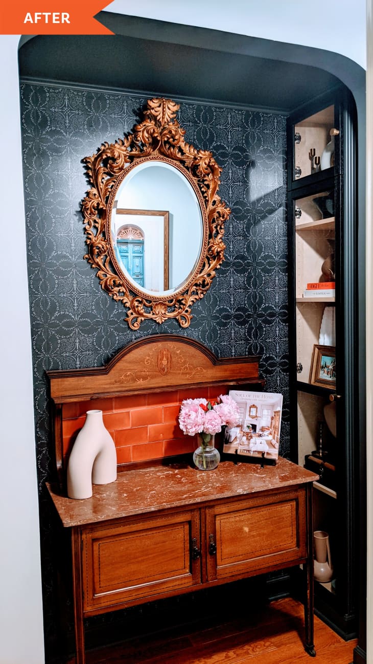 After: a wooden vanity under an oval mirror
