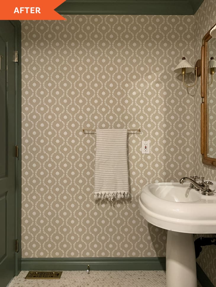 After: wallpapered wall with green trim in bathroom