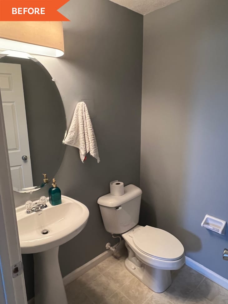 Before: gray bathroom with tiled floors