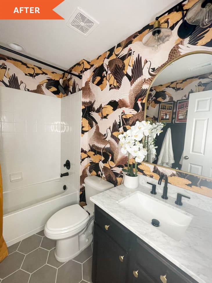 After: Bathroom with arched mirror, hex tile floors, and avian-themed wallpaper