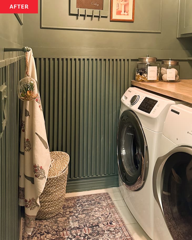 After: a green laundry room with a towel hanging across from washing machines