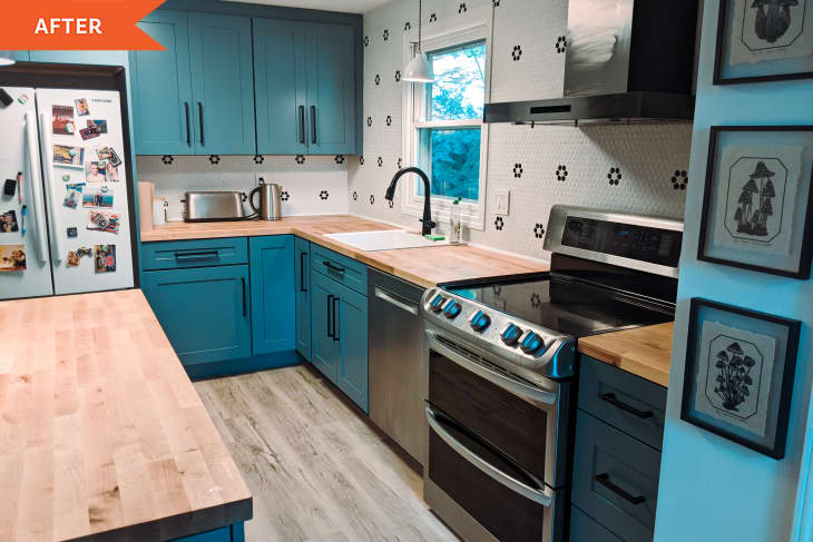 After: a kitchen with blue cabinets and stainless steel appliances