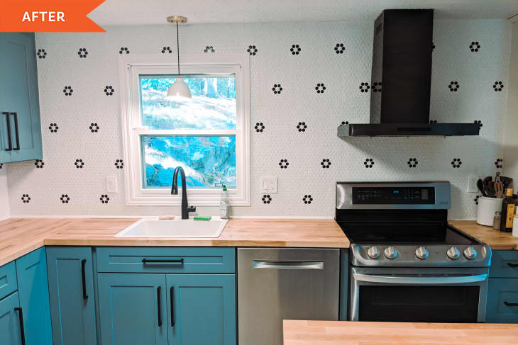 After: a kitchen with black and white walls and blue cabinets