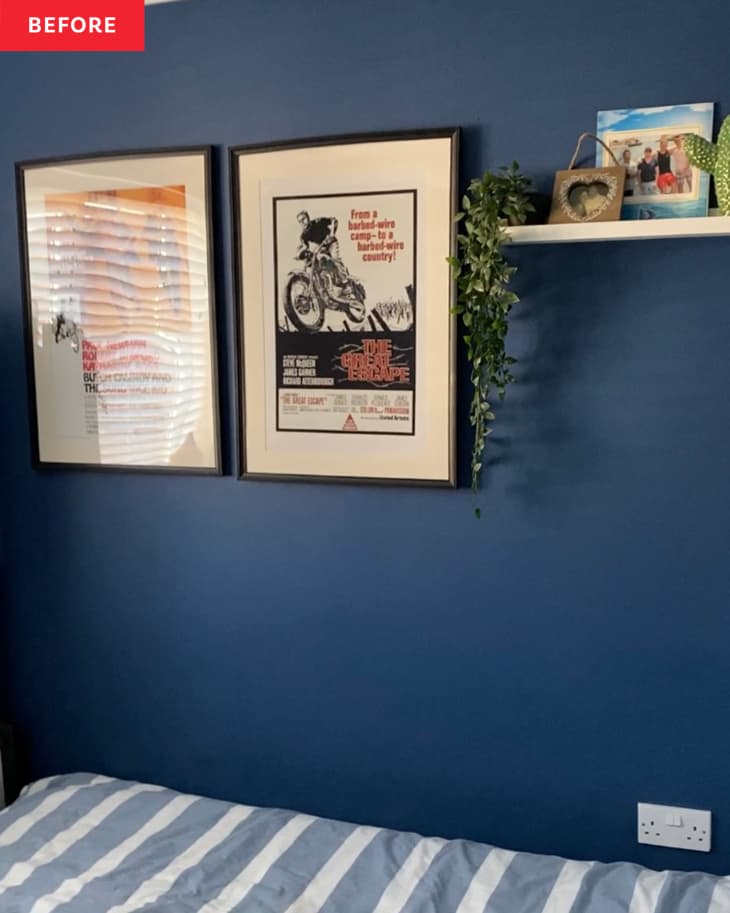 Before: two posters hanging on a blue wall above a bed