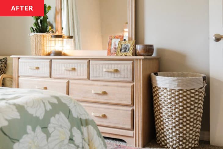 After: a tan dresser with a mirror on top next to a laundry hamper
