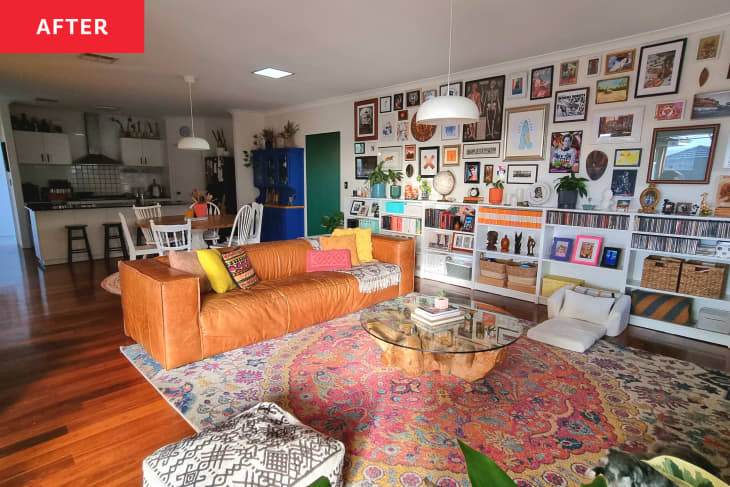 After: a white living room with a large gallery wall of framed photos and works of art by a tan sofa and colorful rug