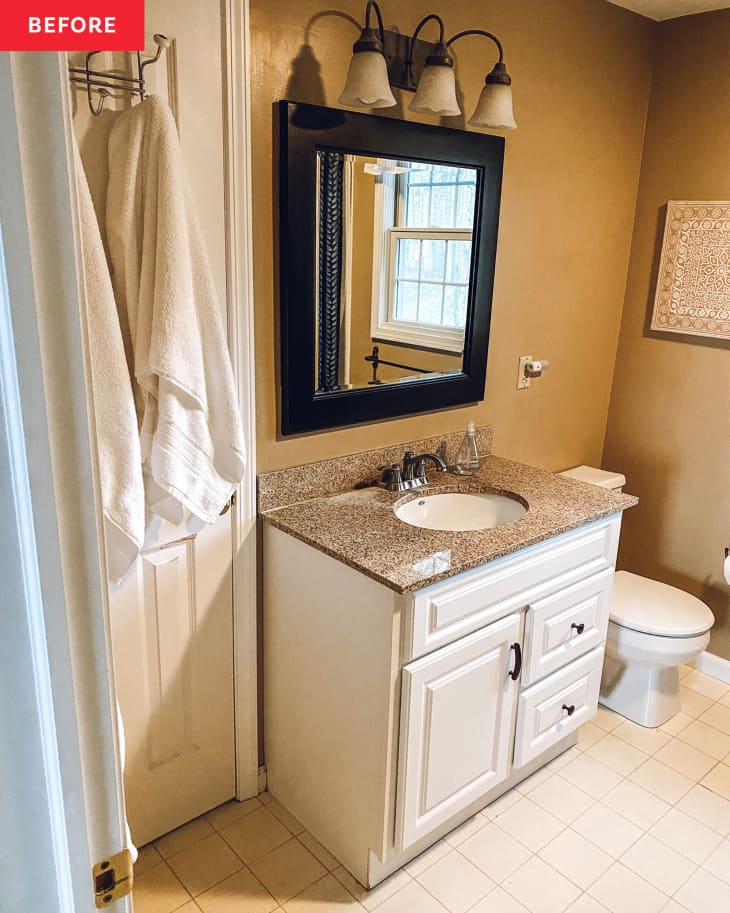 Before: a light brown bathroom with a rectangular mirror above a sink with white cabinets