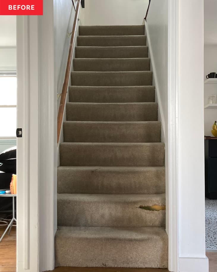 Before: the bottom of stairs with tan carpet