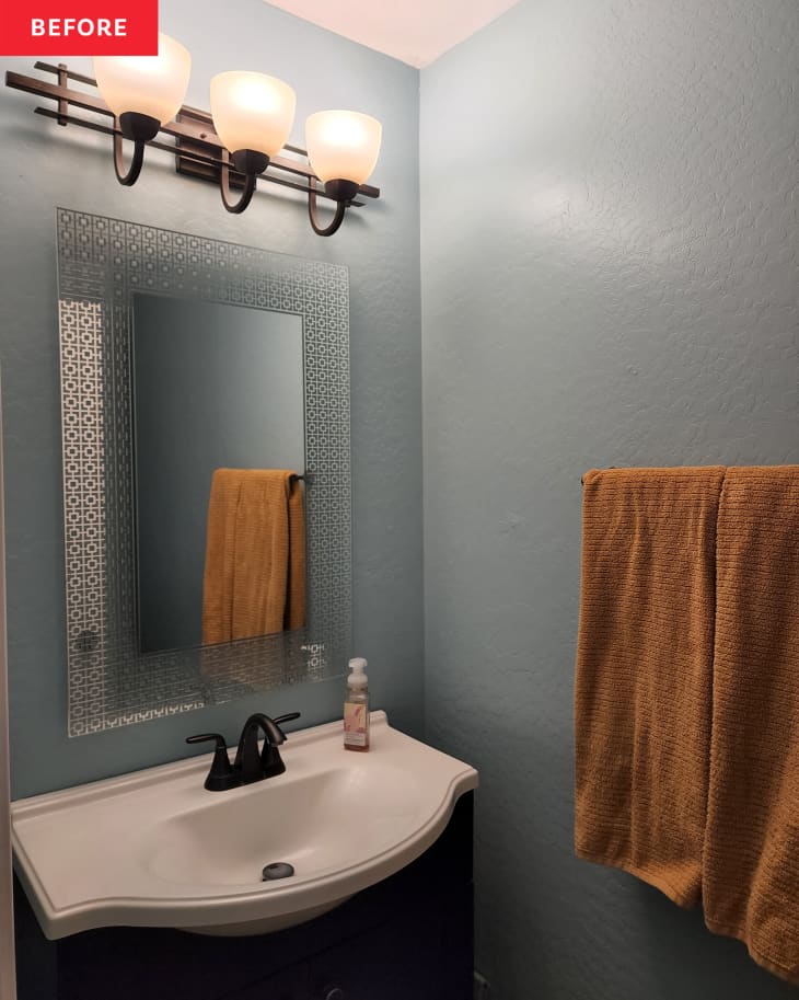 Before: a bathroom sink with a rectangular mirror above on a light blue wall