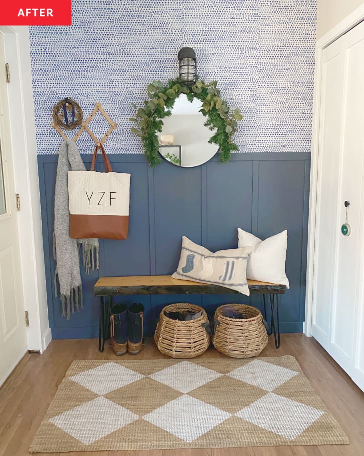 After: an entryway with a blue wall and tan and white rug
