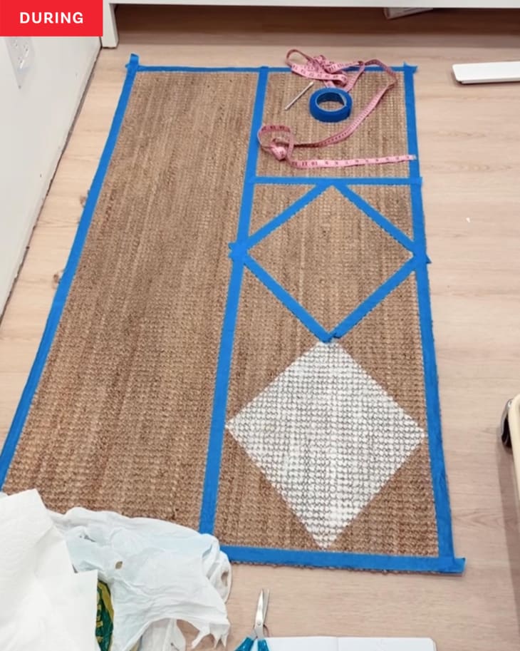 During: Jute rug with tape on it