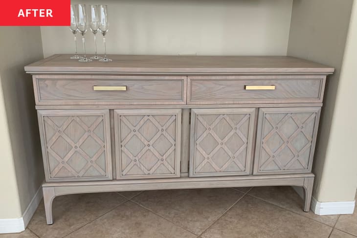 After: a finished table with gold handles on the drawers and champagne flutes on top