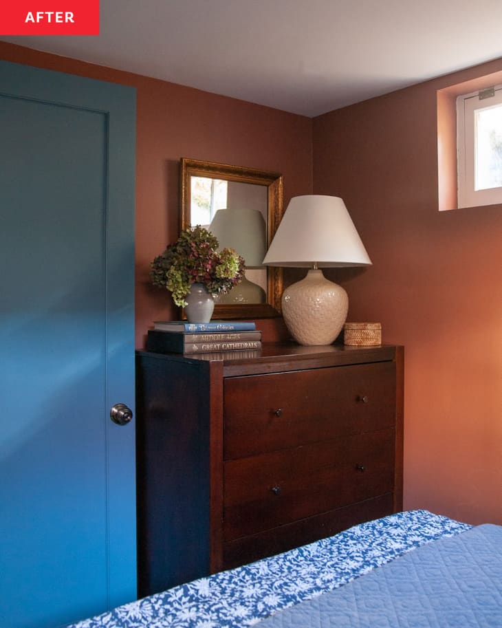 After: a wooden dresser in the corner of a bedroom next to a blue door