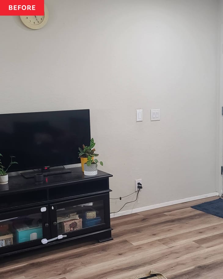 Before: a white wall with a tv on a stand