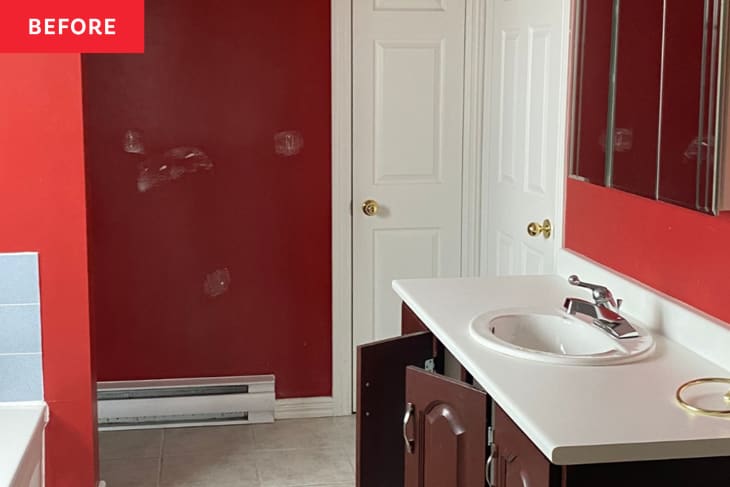 Before: Bathroom with red walls and brown vanity