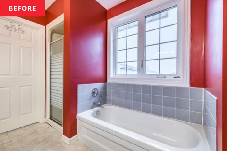 Before: Built-in tub in alcove of red bathroom