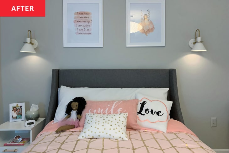 After: a bed with pink blankets and pillows with pink art above the bed