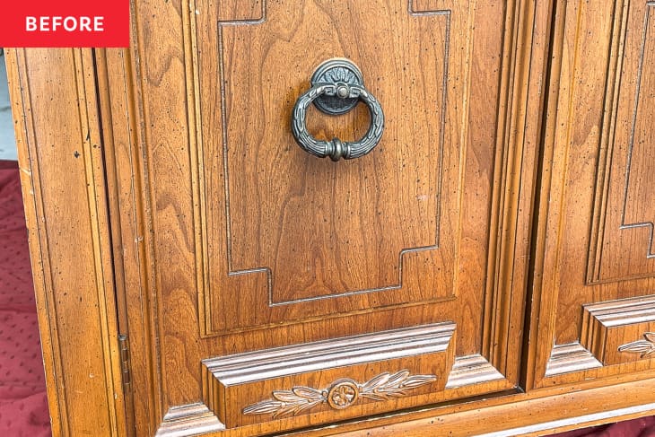 Before: a wooden panel of a brown cabinet with a metal knob