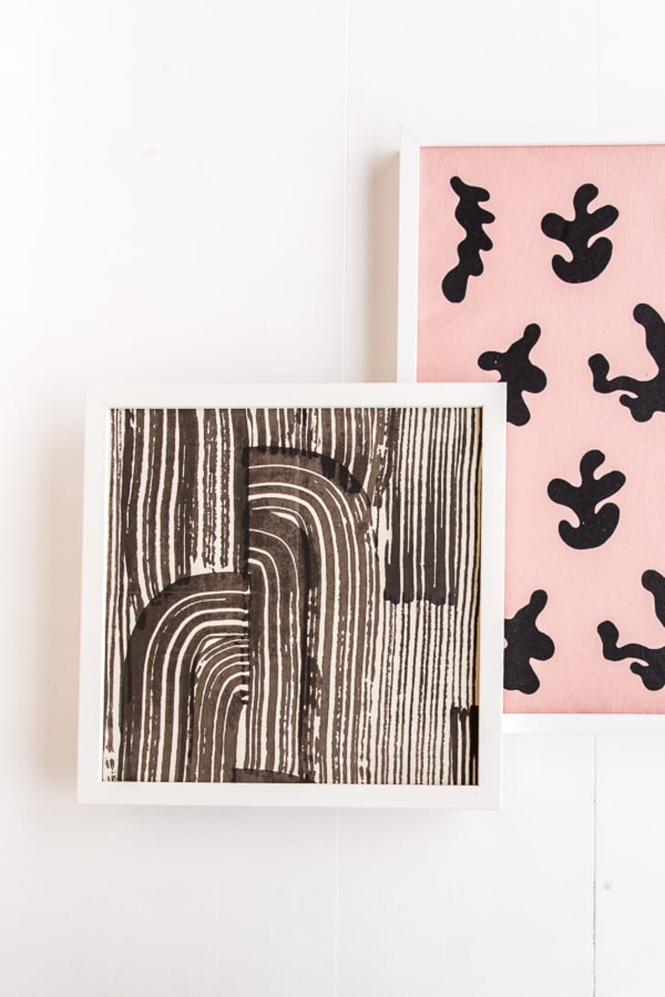 Two pink and black art prints