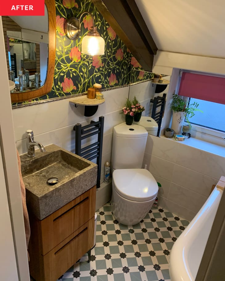 After: a bathroom with floral wallpaper and a granite sink