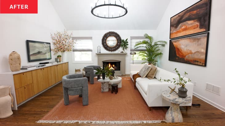 After: Living room with bright white walls, a gray-tan fireplace, and modern furnishings