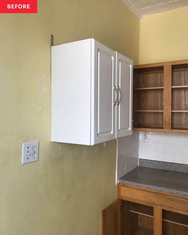 Summer McCorkle's kitchen before renovation with white floating cabinet.