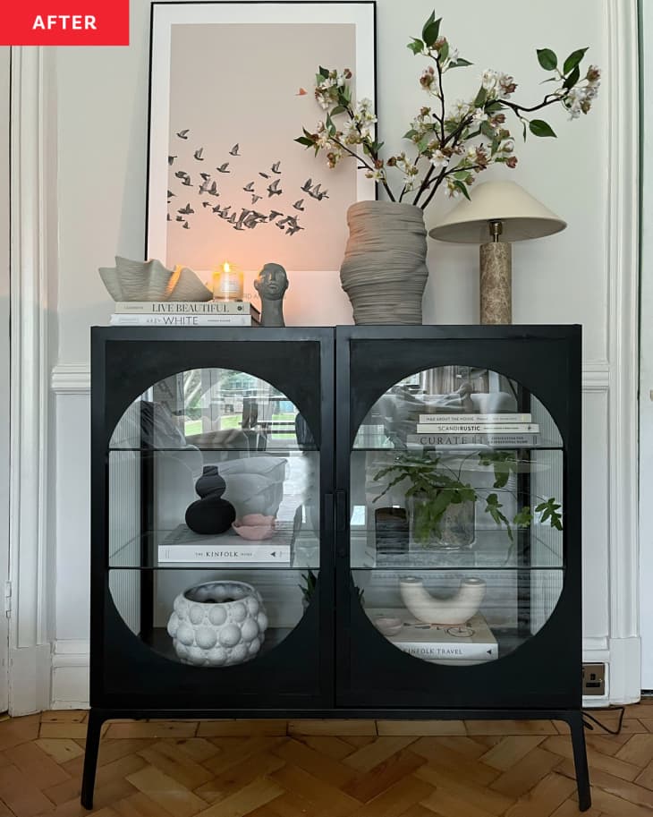 After: Black glass cabinet with accessories