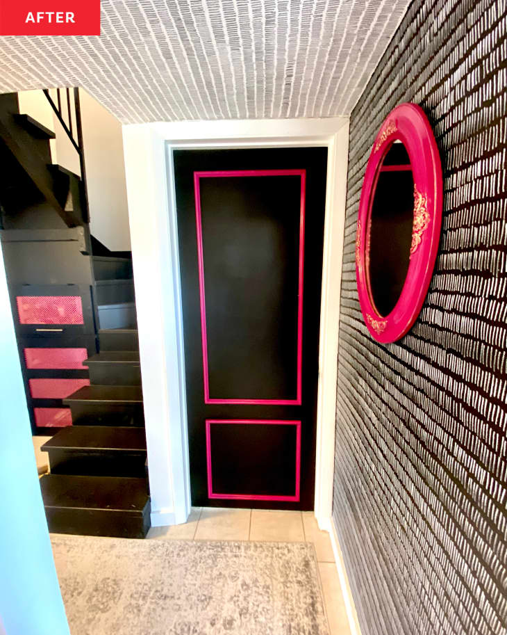 After: a black and white entryway wall with pink and black accent colors