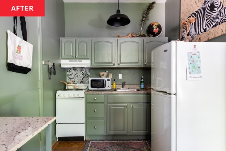Kitchen cabinets painted green.