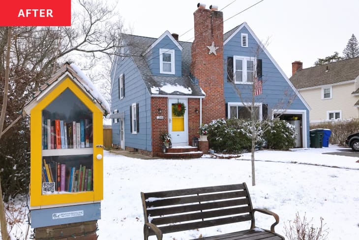 After: Blue snow-covered house with Little Free Library in front of it